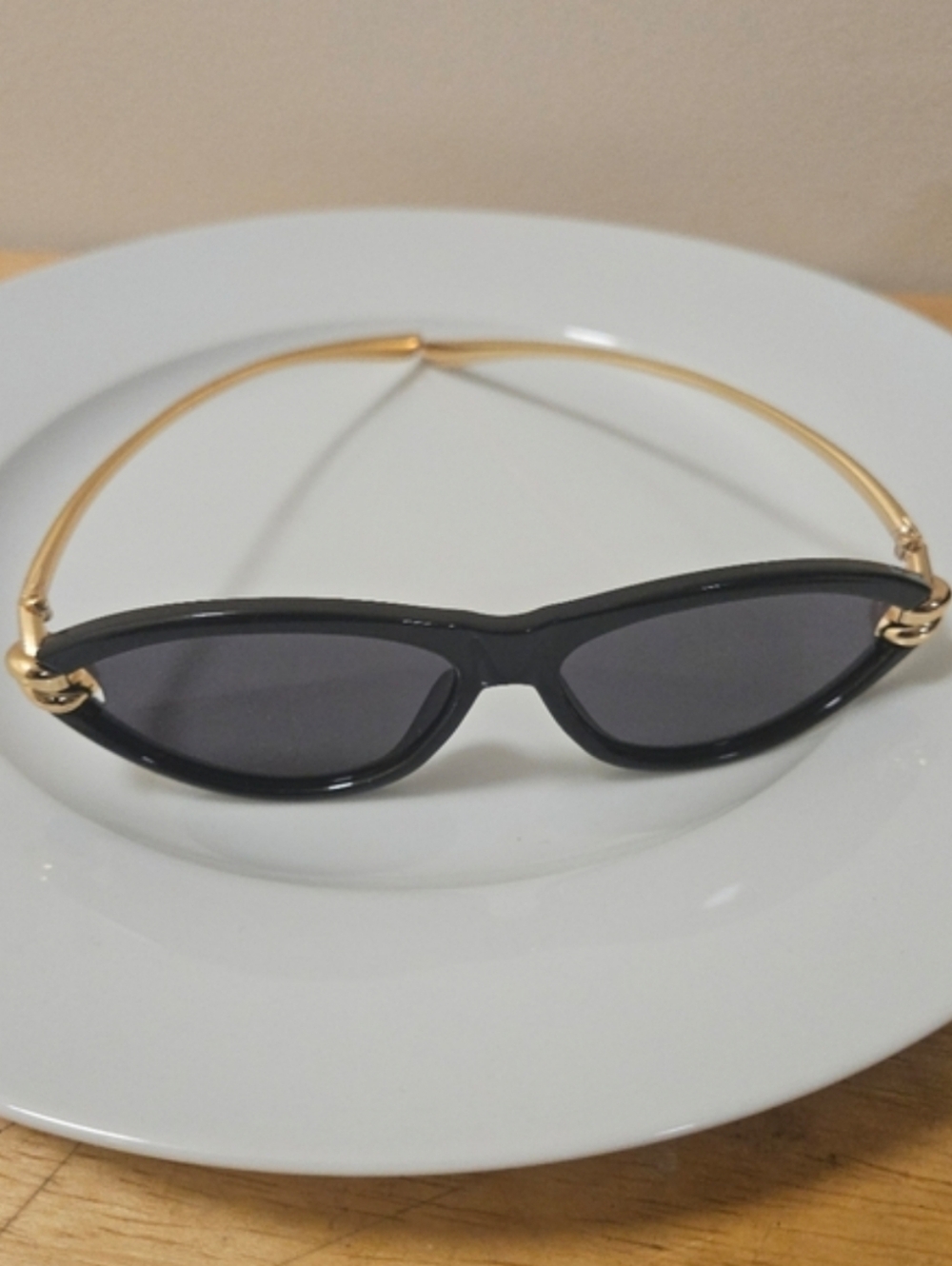 Black Cat-Eye Sunglasses with Gold Knot Accents